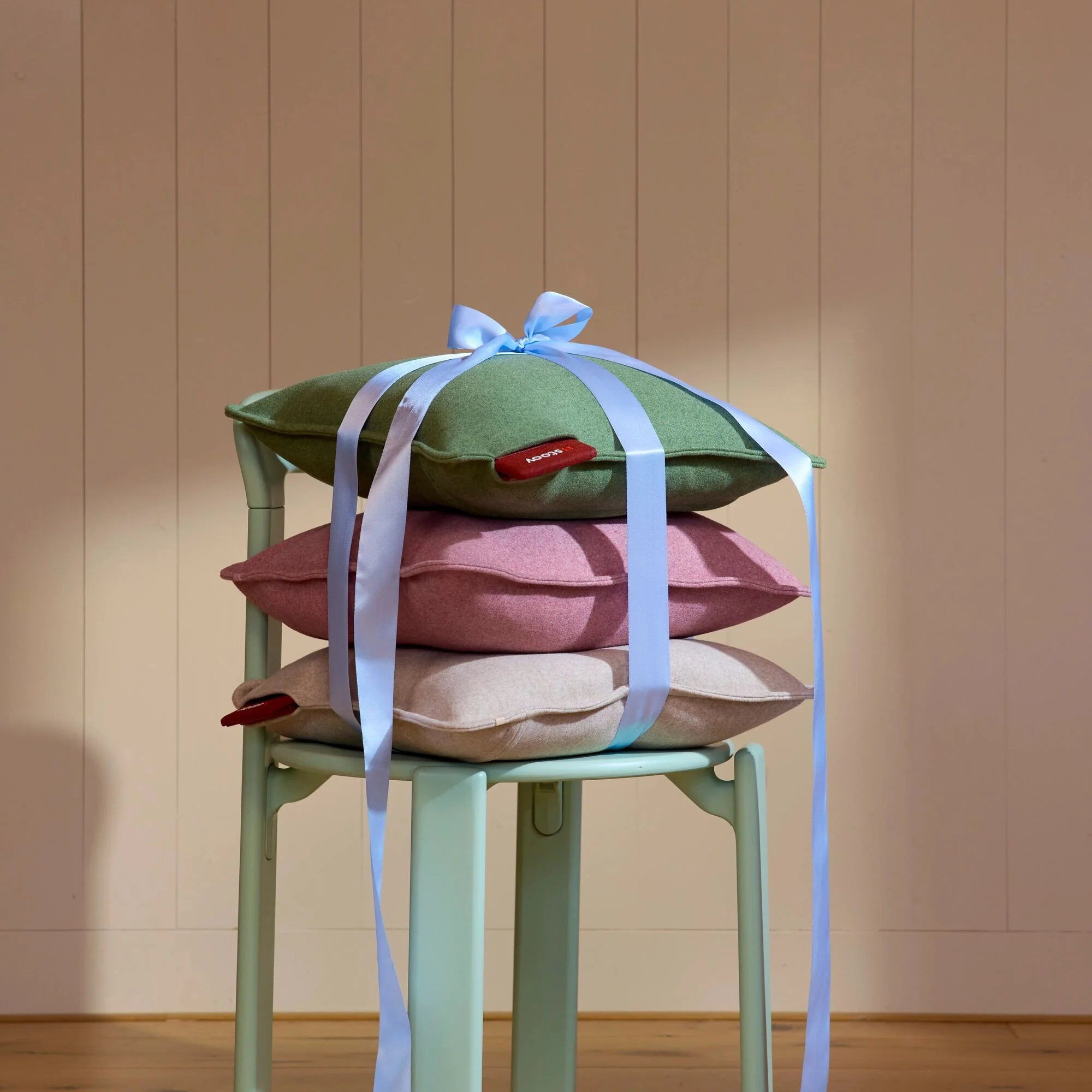 A Ploov cushion wrapped as a gift